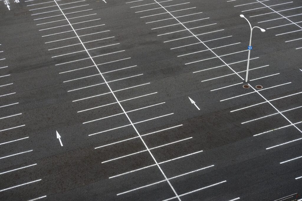 Empty Parking Lot With Arrows That Can Improve Safety